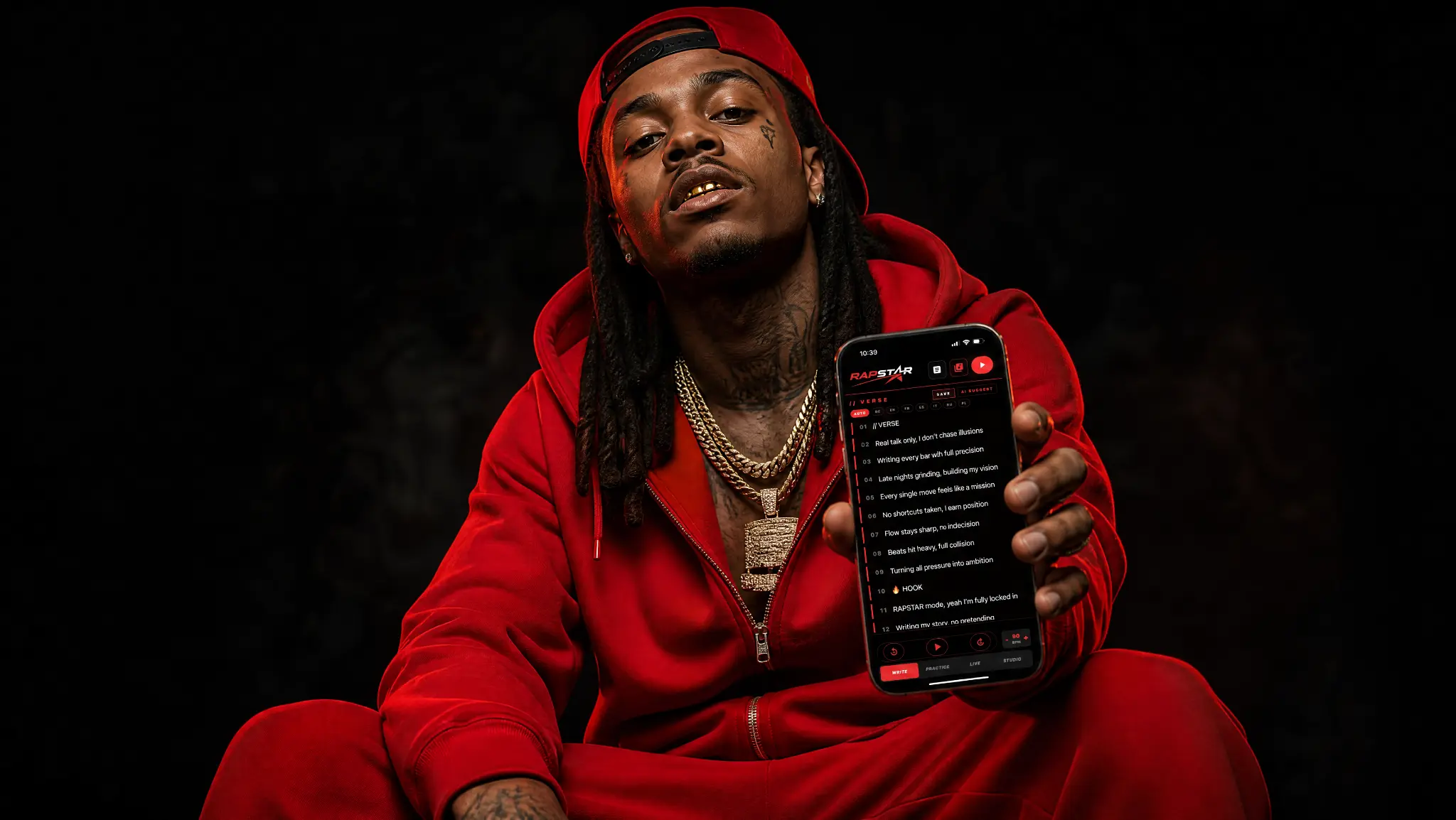 RAPSTAR red male rapper in red outfit and cap holding the RAPSTAR app